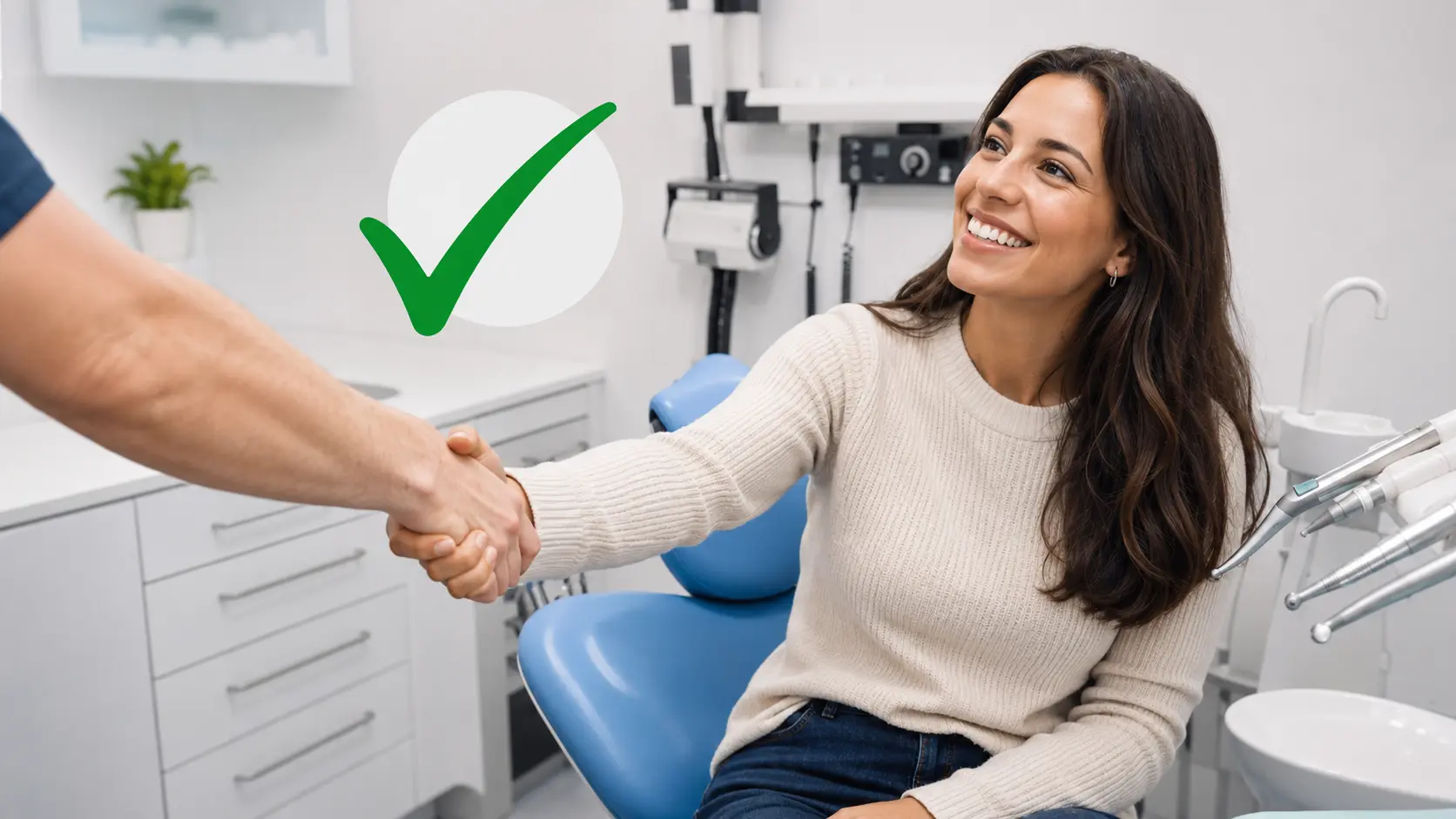 Happy patient shaking hands with her dentist